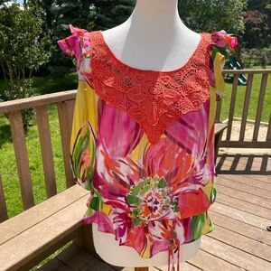 Bright summer blouse with crochet accent and ruffled sleeves